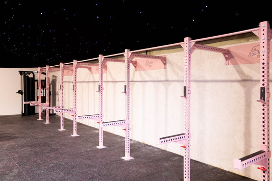 Row of pink freyja power rigs in a female gym