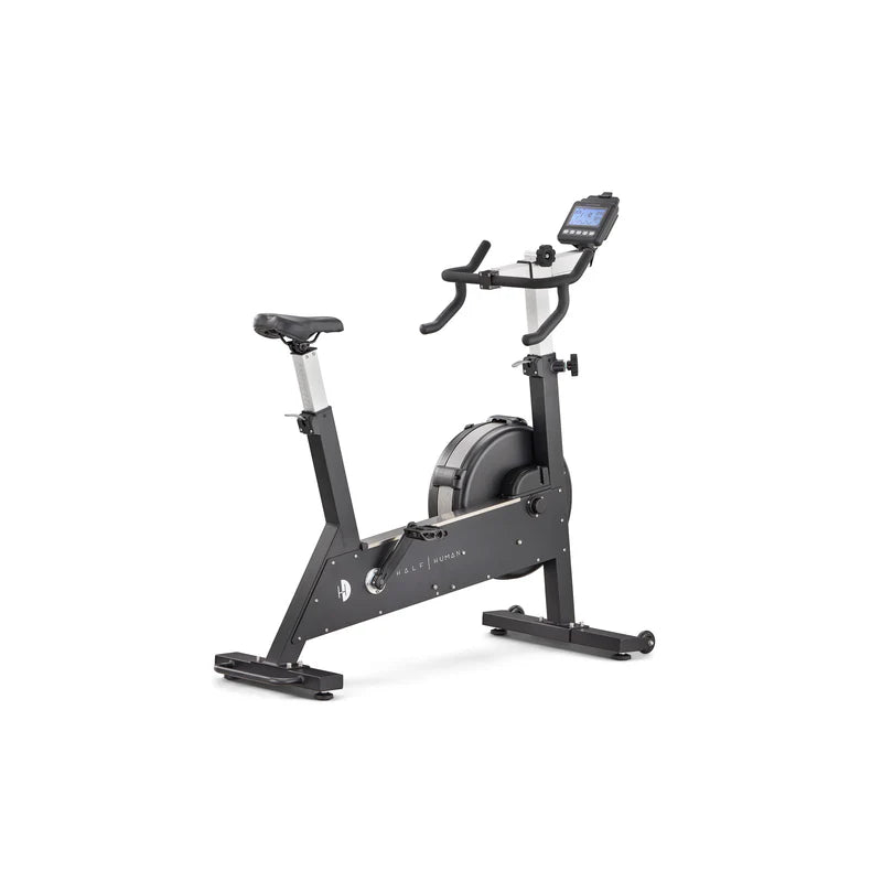 Half human HIIT black exercise bike with digital display on a white background