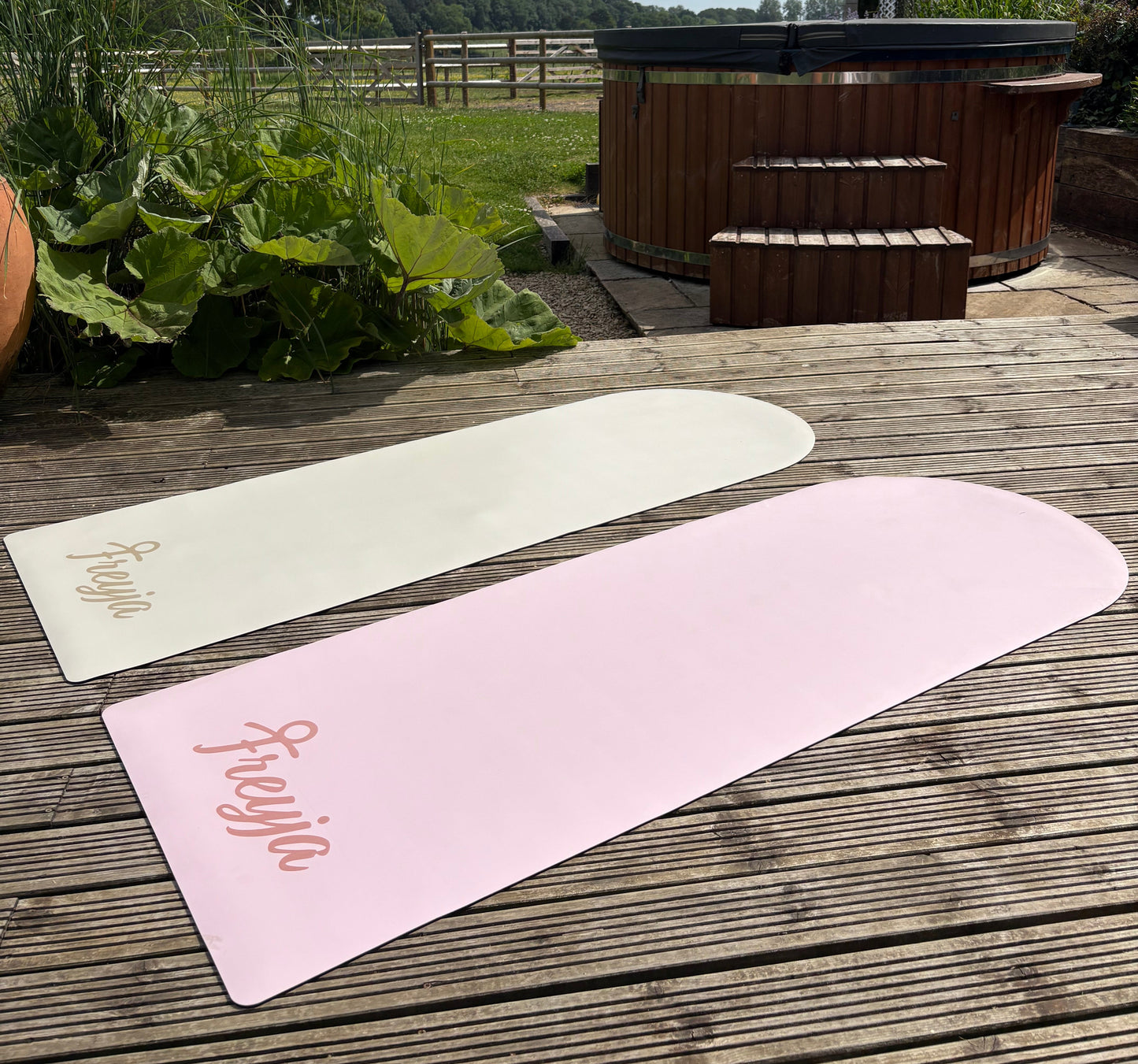 pink/white rubber yoga mat branded with Freyja