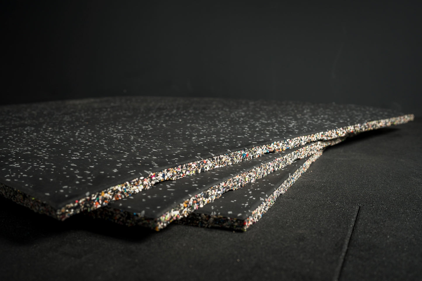 Three grey fleck flooring gym mats