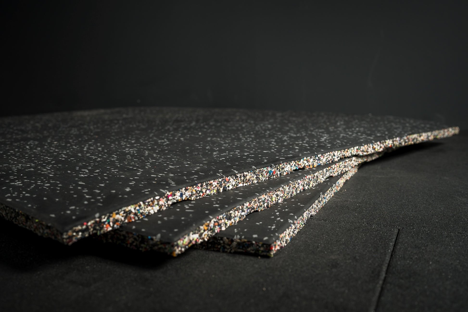 Three grey fleck flooring gym mats