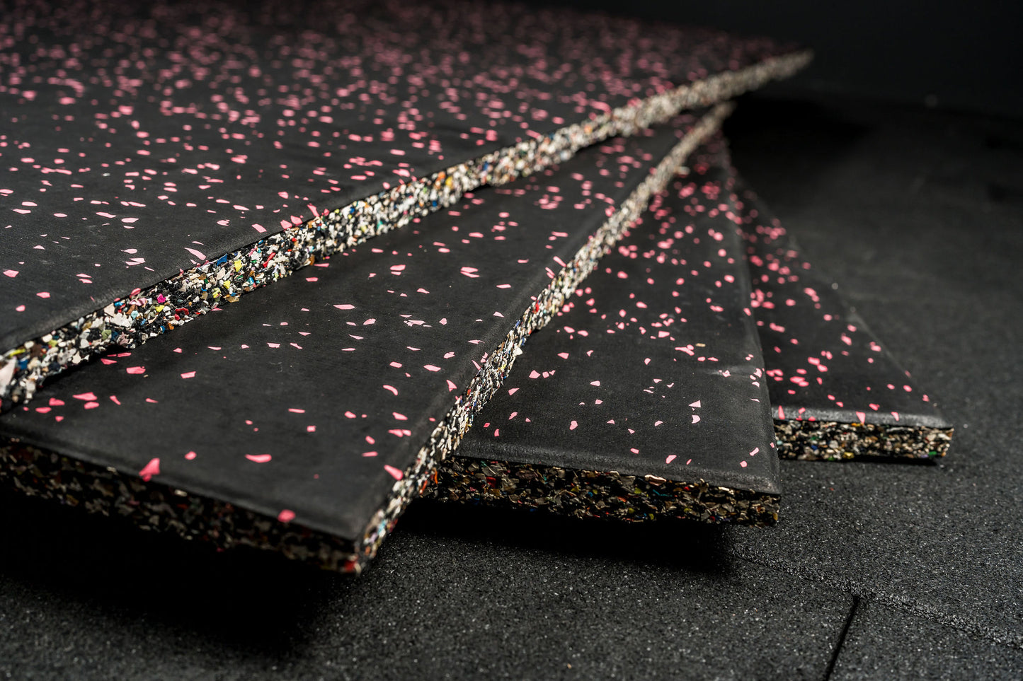 Black gym flooring with pink flecks