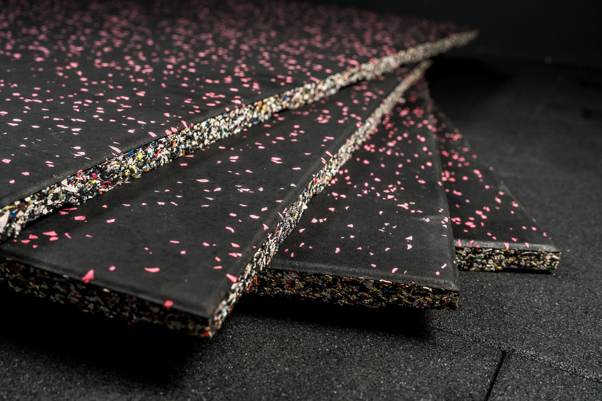 Black gym flooring with pink flecks