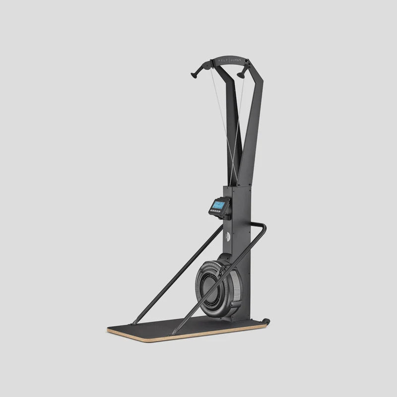 Black air-ski exercise machine on a light grey background with digital display 