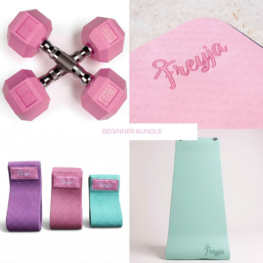Pink dumbbells, resistance bands, and a mat with 'Freyja' branding 