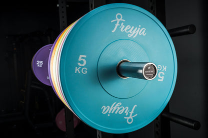 Blue Freyja Fit weight plate displayed on a dark background
