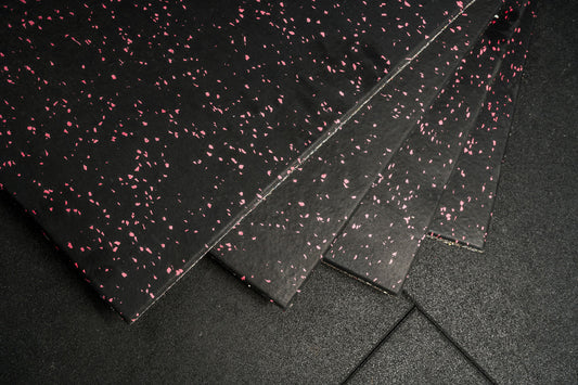Black rubber mat with pink speckles on a black background