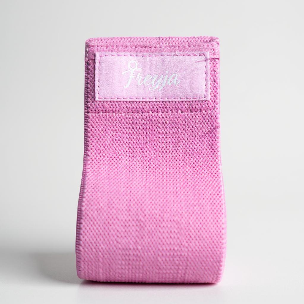 Pink resistance glute band with freyja branding on a white background