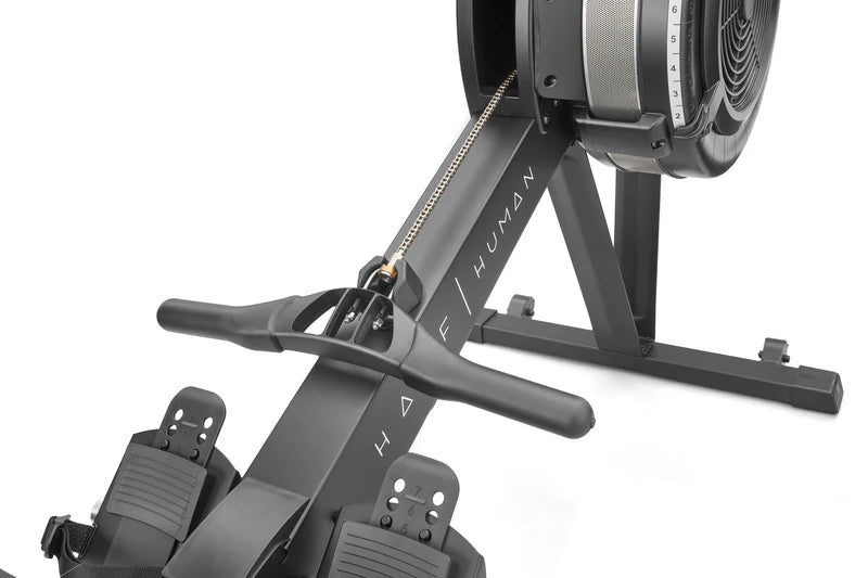 Close up of rowing machine with 'half human' branding on a white background