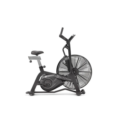 side view of black half human exercise bike on a white background 