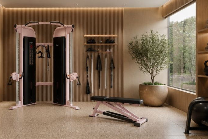 Modern home gym with pink exercise equipment 