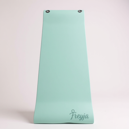 Green freyja branded yoga mat with eyelets on a white background