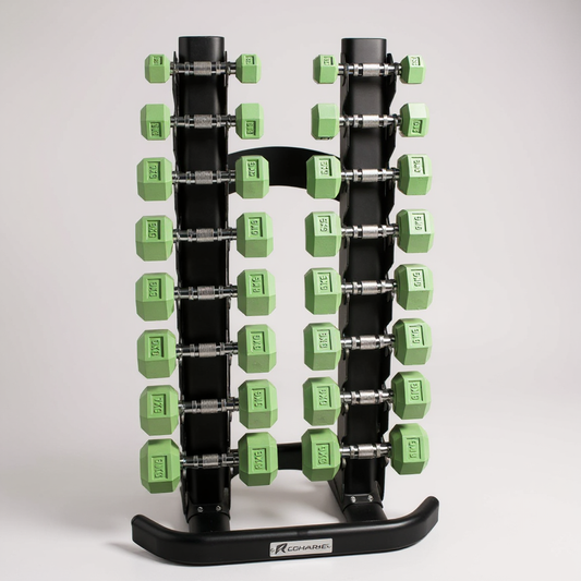 Recharge rack holding a set of green Freyja dumbbells on a grey background