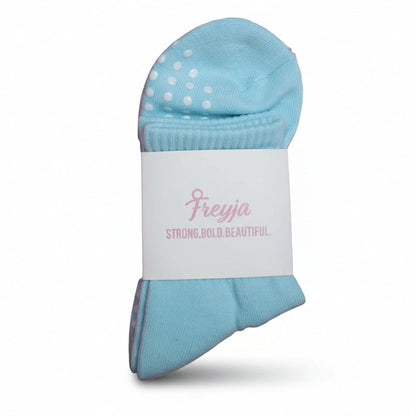 blue grip socks with Freyja branding on 
