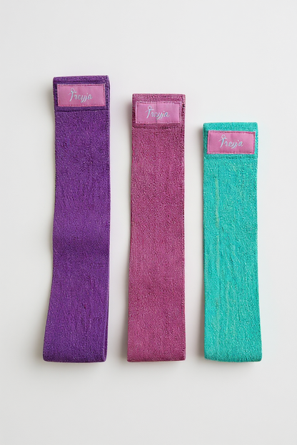 Set of three colorful non-slip fabric resistance bands for glute and thigh workouts by Freyja Fit