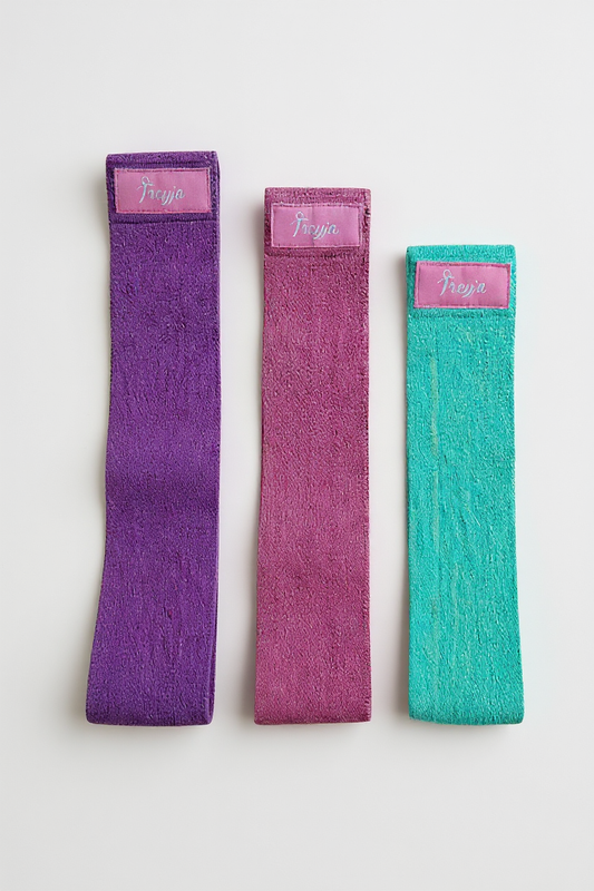 Set of three colorful non-slip fabric resistance bands for glute and thigh workouts by Freyja Fit