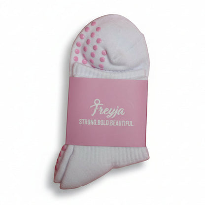White grip socks with Freyja branding on 