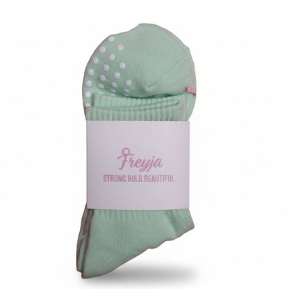 green grip socks with Freyja branding on 
