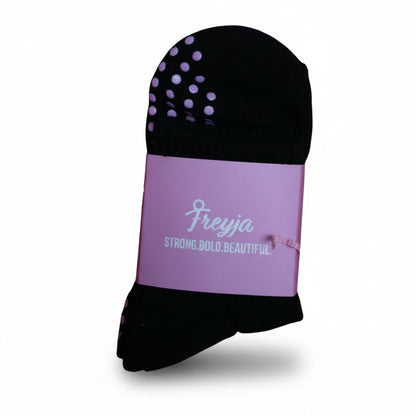 black grip socks with Freyja branding on 