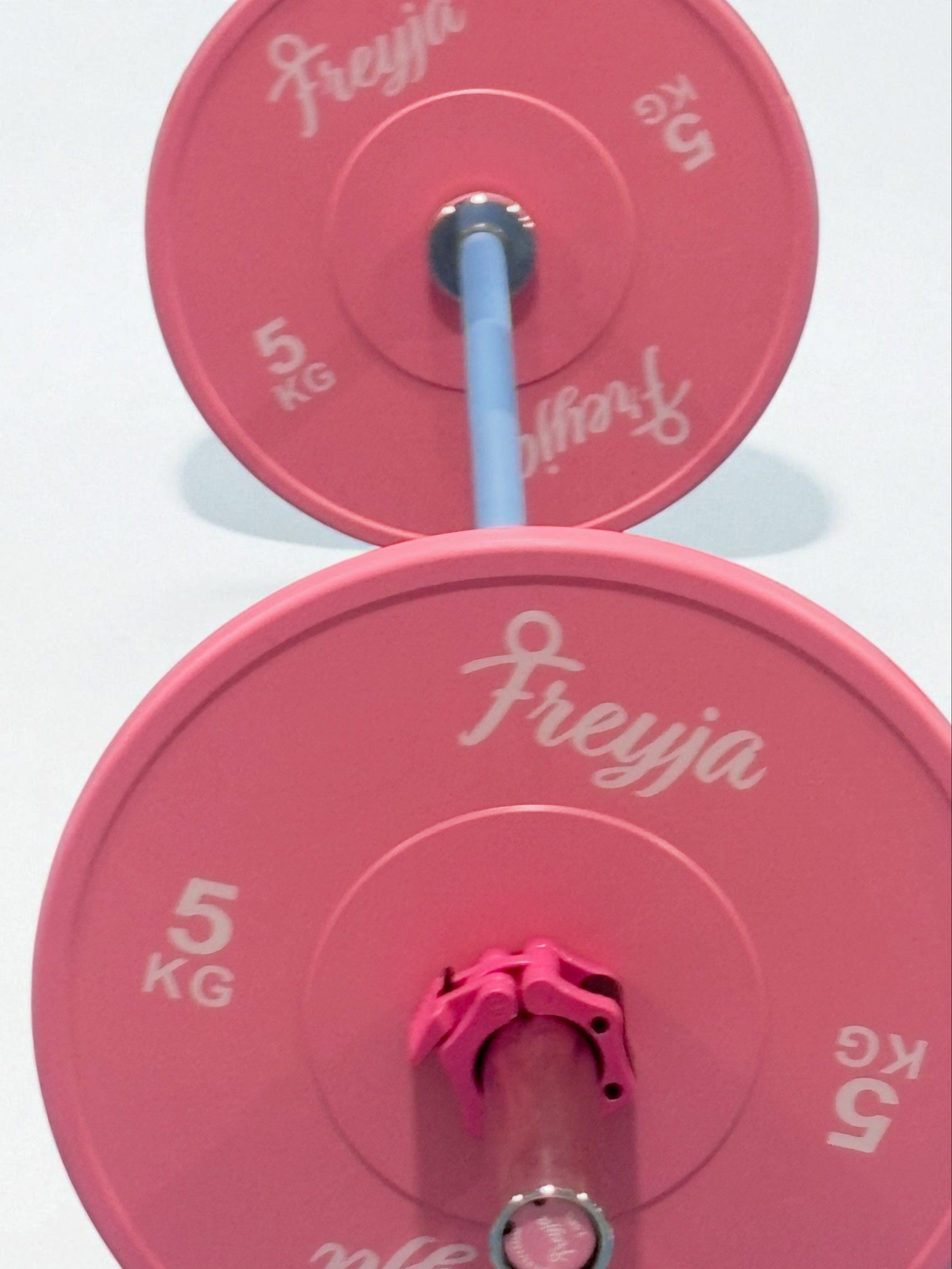 7.5kg blue technique barbell with pink 5kg weight plates branded Freyja for women’s fitness training
