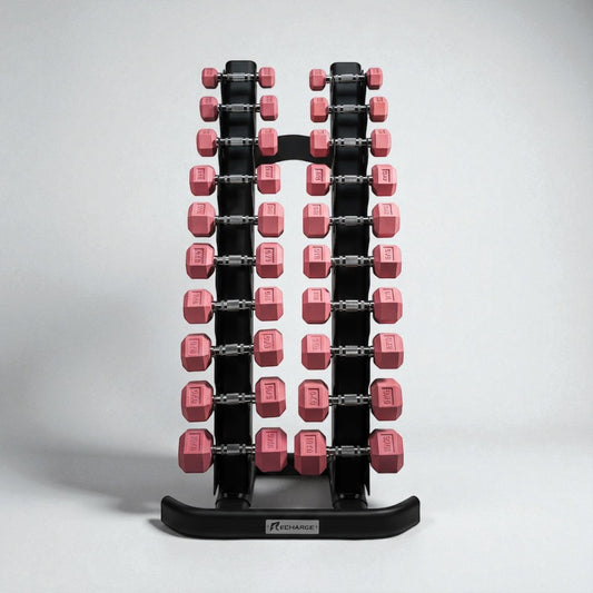 Set of pink hex dumbbells from 1 to 10kg neatly organized on a black vertical dumbbell rack for home or gym use